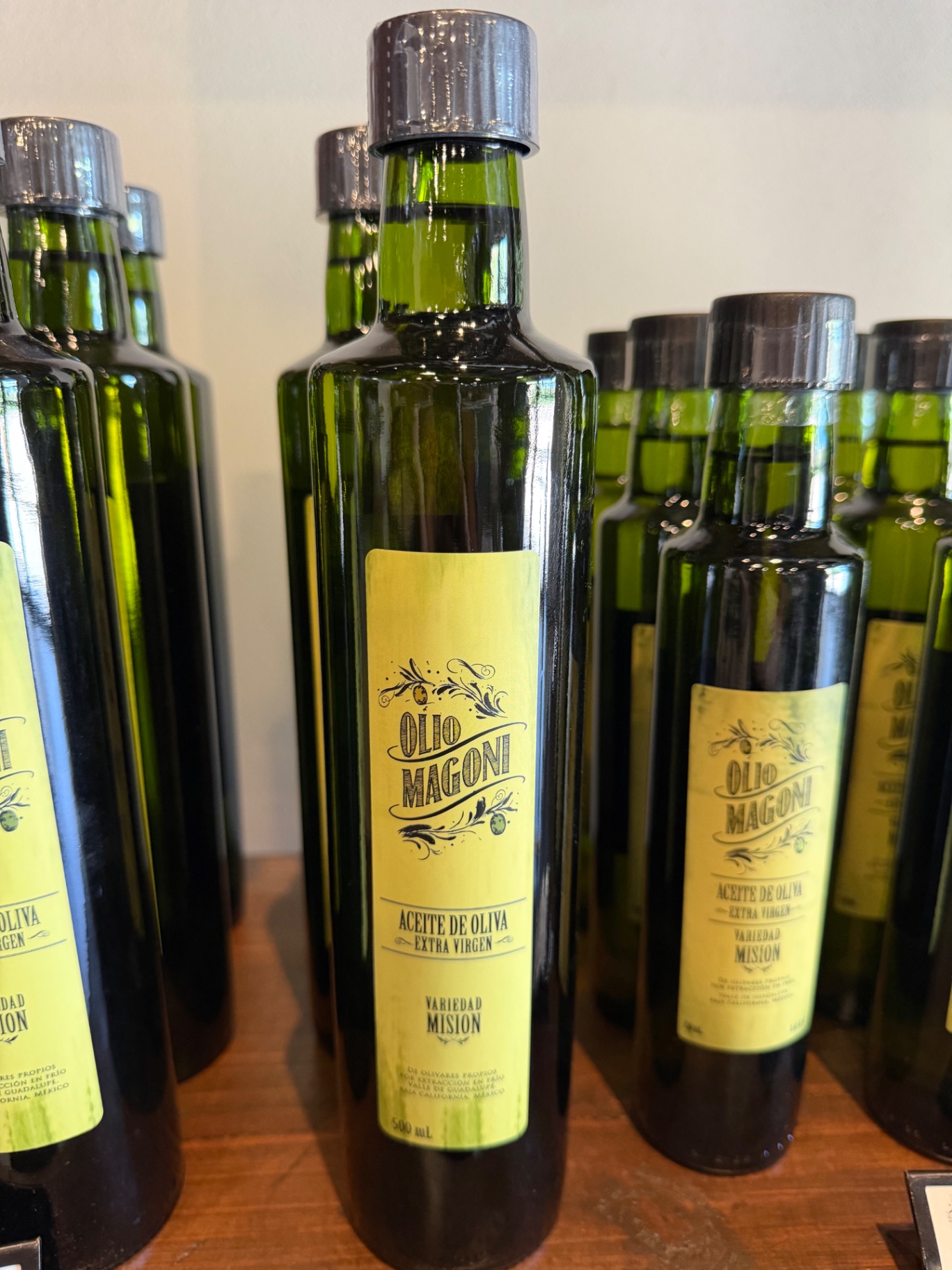 Olio Magoni extra virgin olive oil bottles, Misión varietal.